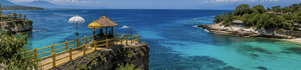 Wooden cliffside viewpoint deck overlooking a turquoise lagoon near Canggu